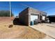 View of the detached two-car garage with brick accents and ample storage space at 2133 W Wilshire Dr, Phoenix, AZ 85009