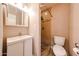 Cozy bathroom featuring a shower and a sink with a vanity for storage at 2301 E University Dr # 210, Mesa, AZ 85213