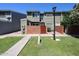 A two-story townhome with manicured lawn and landscaping at 2301 E University Dr # 210, Mesa, AZ 85213