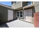 Exterior view of home featuring a covered entryway with a security gate at 2301 E University Dr # 210, Mesa, AZ 85213