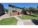 A two-story townhome with manicured lawn and landscaping at 2301 E University Dr # 210, Mesa, AZ 85213