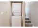 Stacked washer and dryer hookups conveniently located near the carpeted stairs at 2301 E University Dr # 210, Mesa, AZ 85213
