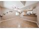 A living room has tile floors, fan, and attached kitchen at 2301 E University Dr # 210, Mesa, AZ 85213