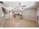 A living room has tile floors, fan, and attached kitchen at 2301 E University Dr # 210, Mesa, AZ 85213