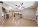 A living room has tile floors, fan, and attached kitchen at 2301 E University Dr # 210, Mesa, AZ 85213