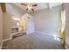 Main bedroom with ensuite bathroom and carpeted floors and a ceiling fan at 2301 E University Dr # 210, Mesa, AZ 85213