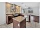 Gourmet kitchen features granite countertops, a tile backsplash, and stainless steel appliances at 23075 W Arrow Dr, Buckeye, AZ 85326