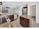 Spacious kitchen offers stainless steel appliances, dark cabinetry, and granite countertops at 23075 W Arrow Dr, Buckeye, AZ 85326