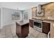 Bright kitchen with granite countertops, tile backsplash, and stainless steel appliances at 23075 W Arrow Dr, Buckeye, AZ 85326