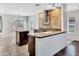 The bright kitchen with island seating opens to the living area at 23075 W Arrow Dr, Buckeye, AZ 85326