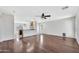 Open-concept living room leading into the kitchen and dining area at 23075 W Arrow Dr, Buckeye, AZ 85326