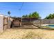 Backyard featuring a chicken coop and a pool at 233 E 7Th Dr, Mesa, AZ 85210