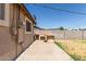View of the backyard with a built-in BBQ and block wall at 233 E 7Th Dr, Mesa, AZ 85210