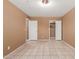 Bedroom featuring tiled floors and multiple doorways leading to closet and other rooms at 233 E 7Th Dr, Mesa, AZ 85210