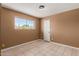 Bedroom featuring light tiled floors and a window which offers an abundance of natural light at 233 E 7Th Dr, Mesa, AZ 85210