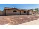 Charming single-story home featuring an attached garage and low maintenance front yard at 233 E 7Th Dr, Mesa, AZ 85210