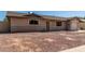 Charming single-story home featuring an attached garage and low maintenance front yard at 233 E 7Th Dr, Mesa, AZ 85210