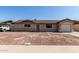 Charming single-story home featuring an attached garage and low maintenance front yard at 233 E 7Th Dr, Mesa, AZ 85210
