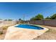Backyard pool surrounded by a concrete deck and a white fence at 233 E 7Th Dr, Mesa, AZ 85210