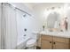 Charming bathroom with a shower-tub combo, shiplap walls, and brushed gold accents at 2337 E Contessa St, Mesa, AZ 85213