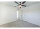 Neutral bedroom with plush carpeting, ceiling fan, and white doors provides a tranquil space at 2337 E Contessa St, Mesa, AZ 85213