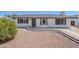 Charming single-story home featuring a well-maintained front yard and a decorative wreath on the front door at 2337 E Contessa St, Mesa, AZ 85213