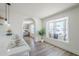 Eat-in kitchen featuring a quartz countertop island, a bay window, and an arched doorway at 2337 E Contessa St, Mesa, AZ 85213