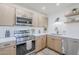 Modern kitchen features stainless steel appliances, white countertops, and a floating shelf at 2337 E Contessa St, Mesa, AZ 85213