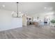 Spacious living area featuring wood flooring, and open floor plan at 2337 E Contessa St, Mesa, AZ 85213