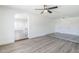 Open concept living area features hardwood floors, recessed lighting, arched doorway, and neutral paint at 2337 E Contessa St, Mesa, AZ 85213