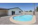 Backyard pool area with a well-maintained pool and updated deck at 2337 E Contessa St, Mesa, AZ 85213
