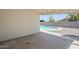 Covered patio area that showcases a beautiful, private pool and well-maintained yard at 2337 E Contessa St, Mesa, AZ 85213