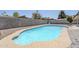 Backyard featuring a private pool, gravel landscaping, and block fence surround at 2337 E Contessa St, Mesa, AZ 85213
