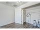 Storage area with shelving, hardwood floors, and a door at 2337 E Contessa St, Mesa, AZ 85213
