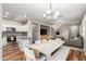 Spacious open-concept living space with a dining area, living room, and modern kitchen at 2458 W Warren Dr, Anthem, AZ 85086
