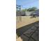 Backyard featuring a gravel yard, a shed and a gazebo frame at 265 W 17Th Ave, Apache Junction, AZ 85120