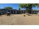 Backyard featuring a gravel yard, xeriscaping and a gazebo frame at 265 W 17Th Ave, Apache Junction, AZ 85120
