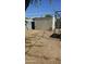 Backyard featuring a gravel yard, a shed, a gazebo frame, and xeriscaping at 265 W 17Th Ave, Apache Junction, AZ 85120