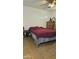 Bedroom featuring neutral walls, a ceiling fan, tile floors, and furnishings at 265 W 17Th Ave, Apache Junction, AZ 85120