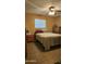 Cozy bedroom featuring neutral walls, a ceiling fan, and tile floors at 265 W 17Th Ave, Apache Junction, AZ 85120