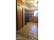 Functional kitchen featuring wooden cabinets, practical appliances, and easy-to-clean tile flooring at 265 W 17Th Ave, Apache Junction, AZ 85120