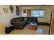 Comfortable living room with a plush sectional, stylish decor, and ample natural light at 265 W 17Th Ave, Apache Junction, AZ 85120
