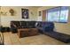 Comfortable living room with a plush sectional, stylish decor, and ample natural light at 265 W 17Th Ave, Apache Junction, AZ 85120