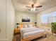 Cozy bedroom featuring a ceiling fan, stylish decor and modern furniture at 2701 E Allred Ave # 171, Mesa, AZ 85204