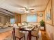 Elegant dining area with modern table, stylish chairs, and clear sightlines to the living room at 2701 E Allred Ave # 171, Mesa, AZ 85204