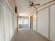Bright hallway enhanced by natural light, leading to a sunroom or enclosed patio area at 2701 E Allred Ave # 171, Mesa, AZ 85204