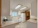 Functional kitchen with modern appliances, convenient sink placement, and a refrigerator at 2701 E Allred Ave # 171, Mesa, AZ 85204