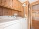Convenient laundry area with washer, dryer, and overhead cabinets for storage at 2701 E Allred Ave # 171, Mesa, AZ 85204