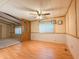 Open living area featuring laminate wood flooring, overhead lighting, and direct access to other rooms at 2701 E Allred Ave # 171, Mesa, AZ 85204