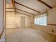 Spacious living room featuring exposed beam ceiling and window with vertical blinds at 2701 E Allred Ave # 171, Mesa, AZ 85204